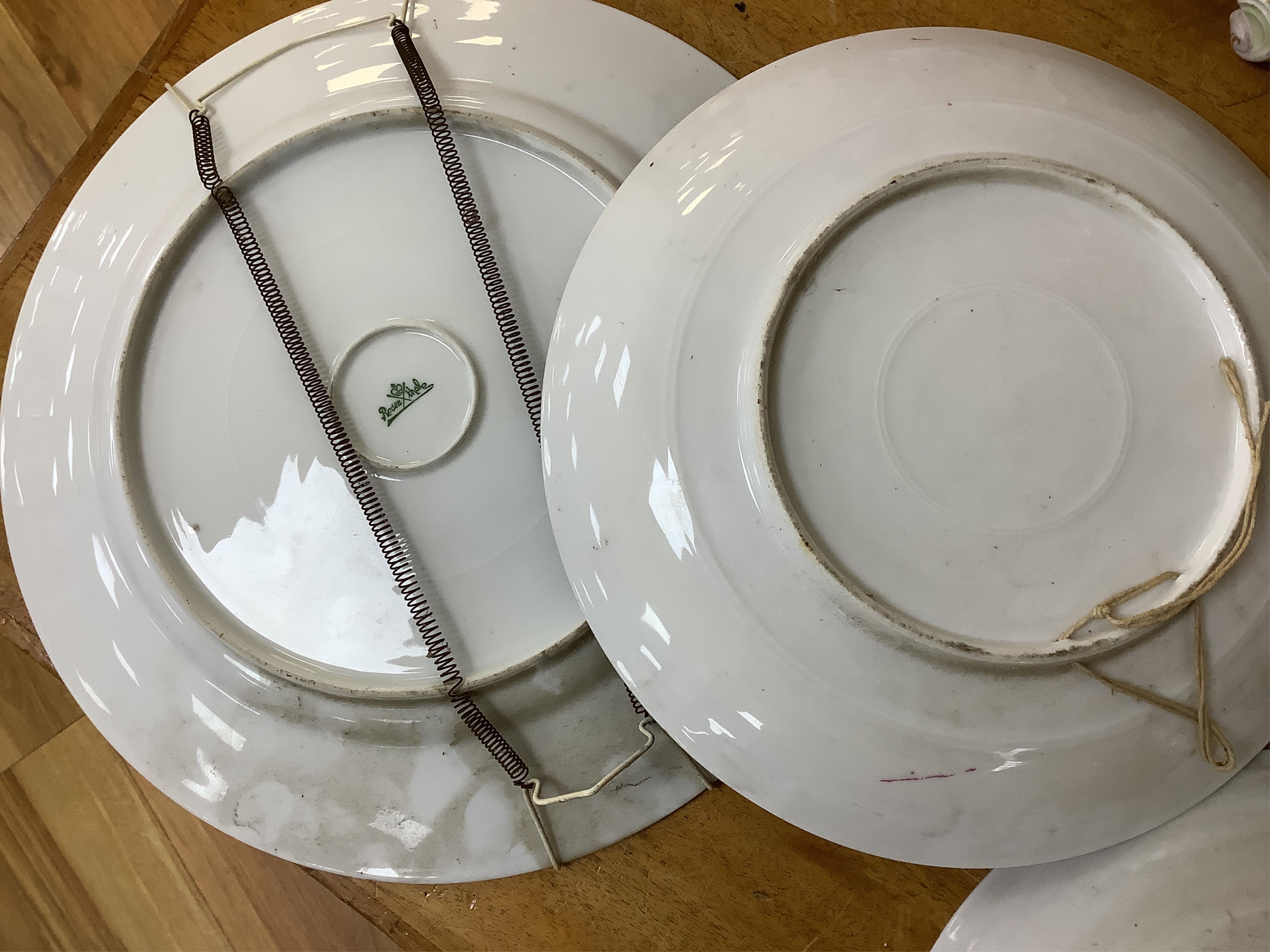 A German porcelain figural centrepiece, lobed dish, three other plates and two others